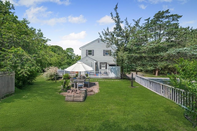 4 Cooks Ln, Westhampton, NY 11977 - back of property featuring a wooden deck