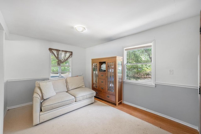 4 Cooks Ln, Westhampton, NY 11977 - living area with healthy amount of natural light and wood finished floors