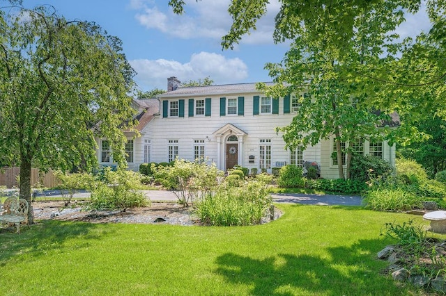 1146 N Ave, New Rochelle, NY 10804 - colonial-style house with a front yard and a chimney