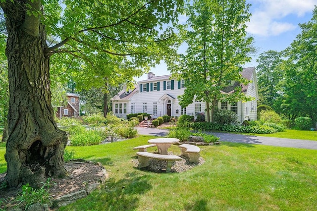 1146 N Ave, New Rochelle, NY 10804 - view of front of home with a front yard and a chimney