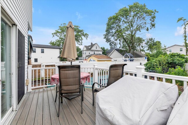 230 Mosher Ave, Woodmere, NY 11598 - wooden deck featuring outdoor dining space and a residential view