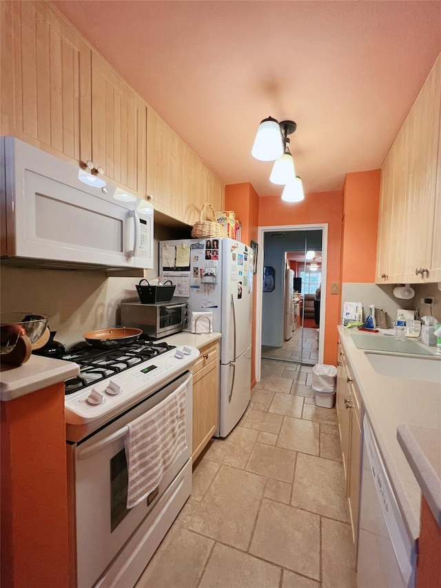 1815 215th St Unit 1G, Flushing, NY 11360 - kitchen featuring white appliances, stone tile flooring, light countertops, and light brown cabinetry