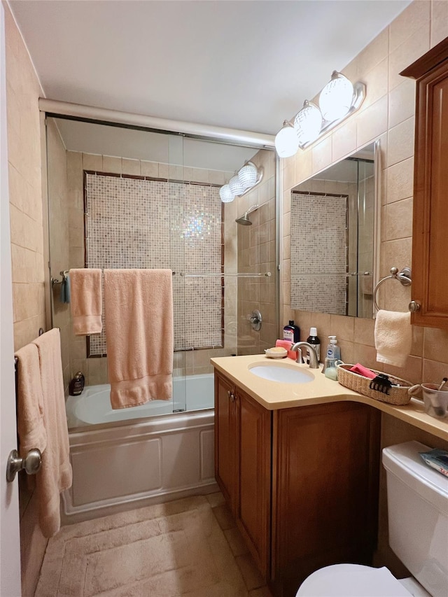 1815 215th St Unit 1G, Flushing, NY 11360 - bathroom with shower / bath combination with glass door, vanity, and tile walls