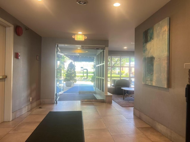 100 Cuttermill Rd Unit 3E, Great Neck, NY 11021 - entryway with light tile patterned flooring and recessed lighting