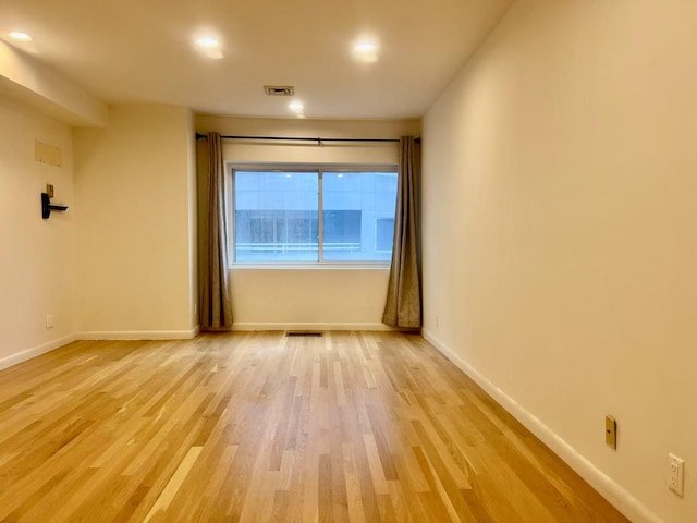 100 Cuttermill Rd Unit 3E, Great Neck, NY 11021 - unfurnished room featuring light wood finished floors and recessed lighting