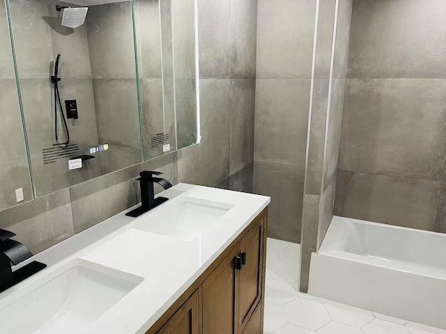 100 Cuttermill Rd Unit 3E, Great Neck, NY 11021 - bathroom with double vanity, tile walls, a bath, a shower, and tile patterned floors