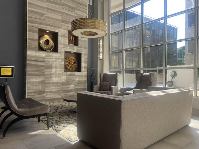 100 Cuttermill Rd Unit 3E, Great Neck, NY 11021 - community lobby with a high ceiling, floor to ceiling windows, and tile walls