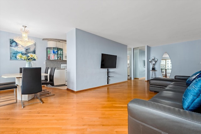 2928 W 5th St Unit 10P, Brooklyn, NY 11224 - living room with light wood-type flooring and arched walkways