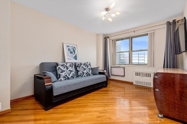 2928 W 5th St Unit 10P, Brooklyn, NY 11224 - living area with radiator and light wood-type flooring