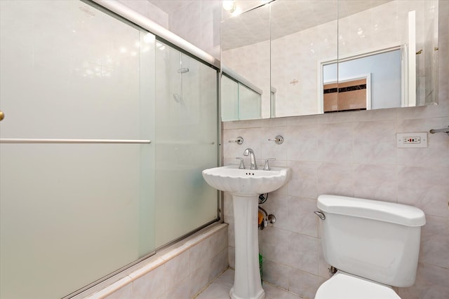 2928 W 5th St Unit 10P, Brooklyn, NY 11224 - bathroom with a shower with door and tile walls