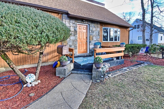 467 Carlls Path, Deer Park, NY 11729 - view of exterior entry featuring a shingled roof and stone siding