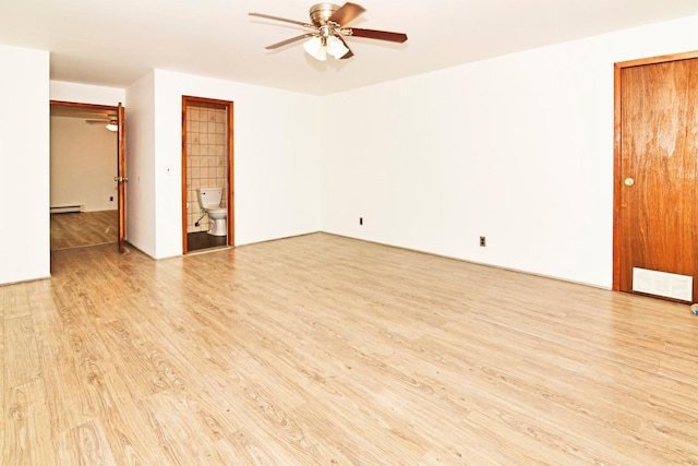 467 Carlls Path, Deer Park, NY 11729 - spare room featuring a ceiling fan, light wood-style flooring, and a baseboard heating unit