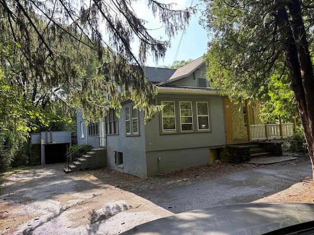 270 N Highland Ave, Pearl River, NY 10965 - view of home's exterior with a shingled roof and stucco siding