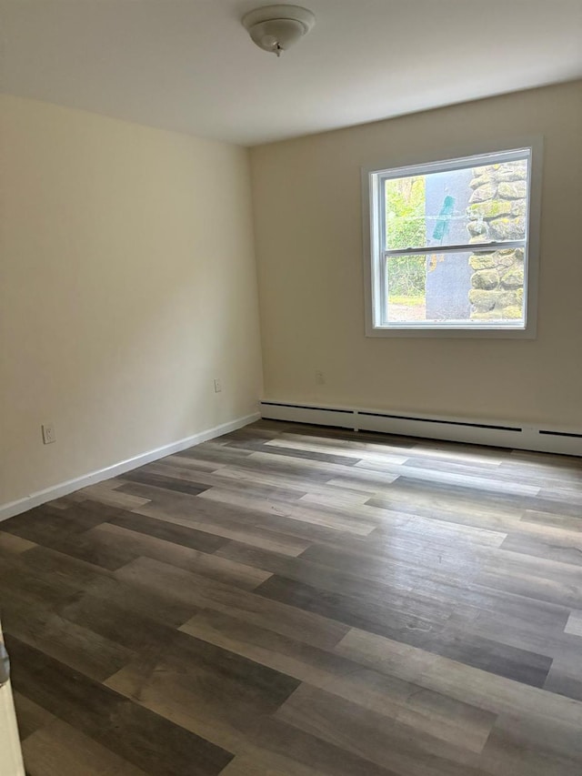 270 N Highland Ave, Pearl River, NY 10965 - spare room featuring a baseboard heating unit and dark wood-type flooring