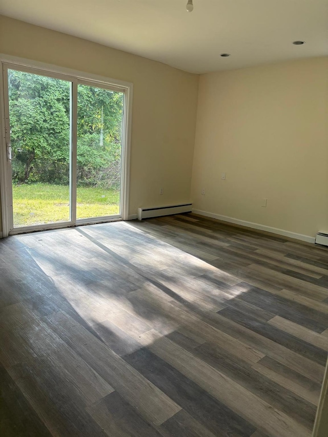 270 N Highland Ave, Pearl River, NY 10965 - spare room featuring a baseboard radiator, healthy amount of natural light, dark wood-type flooring, and recessed lighting
