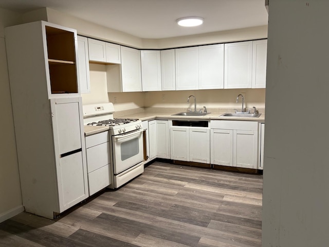 270 N Highland Ave, Pearl River, NY 10965 - kitchen featuring gas range gas stove, dark wood-style floors, white cabinets, and light countertops