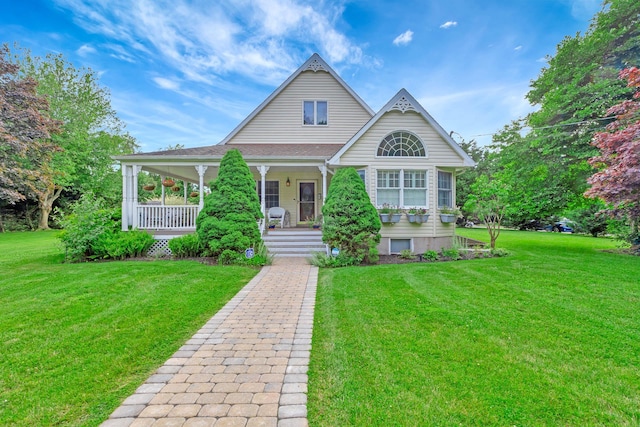 600 Shipyard Ln, East Marion, NY 11939 - victorian house with covered porch and a front lawn
