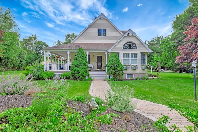 600 Shipyard Ln, East Marion, NY 11939 - view of front of house with a front lawn and covered porch