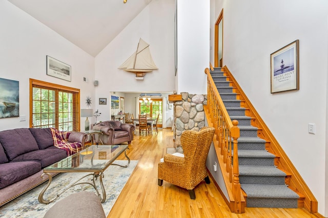 600 Shipyard Ln, East Marion, NY 11939 - living area with high vaulted ceiling, stairway, and wood finished floors