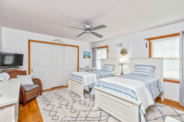 600 Shipyard Ln, East Marion, NY 11939 - bedroom with a closet, wood finished floors, and ceiling fan
