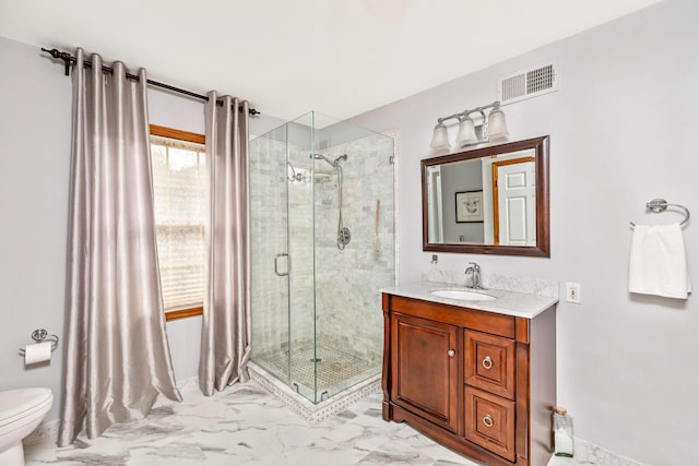 600 Shipyard Ln, East Marion, NY 11939 - full bathroom with marble look tiles, a shower stall, and vanity