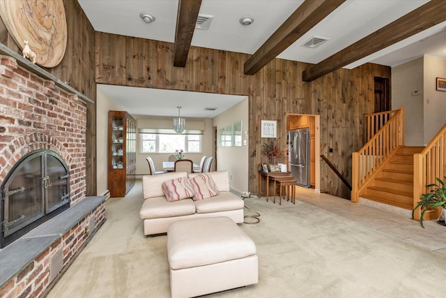 790 Adams St, Baldwin, NY 11510 - living room featuring wood walls, beamed ceiling, stairs, a brick fireplace, and light colored carpet