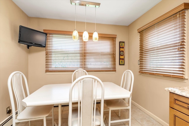 790 Adams St, Baldwin, NY 11510 - dining space featuring a baseboard heating unit and light tile patterned floors