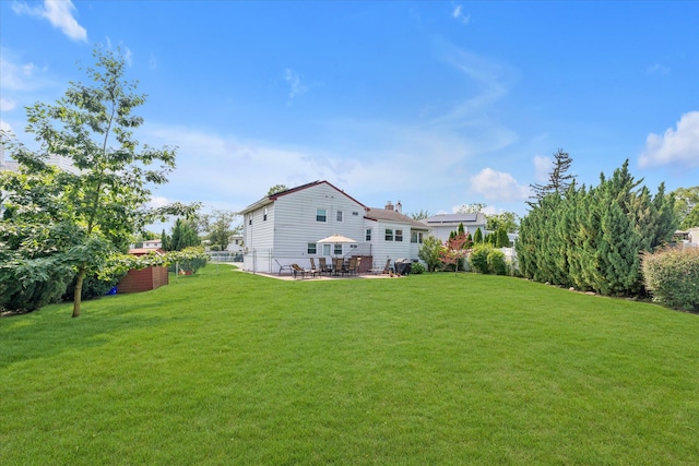 790 Adams St, Baldwin, NY 11510 - rear view of house featuring a patio area and a chimney