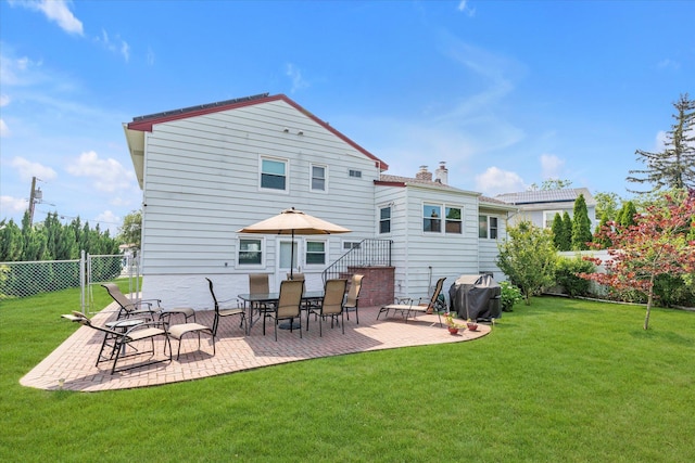 790 Adams St, Baldwin, NY 11510 - back of property with a patio area and a chimney