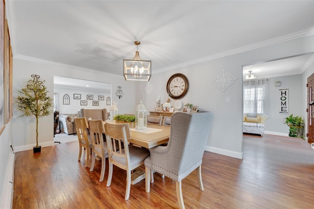 5 Fox Rd, Middle Island, NY 11953 - dining space featuring a chandelier, wood finished floors, and ornamental molding