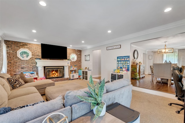5 Fox Rd, Middle Island, NY 11953 - carpeted living area with ornamental molding, brick wall, a fireplace, recessed lighting, and a chandelier