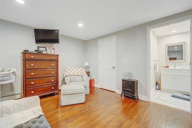5 Fox Rd, Middle Island, NY 11953 - sitting room with light wood-type flooring, recessed lighting, and a baseboard radiator