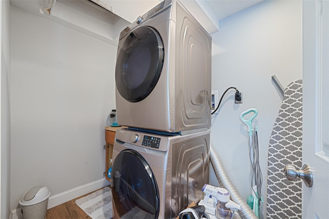 5 Fox Rd, Middle Island, NY 11953 - laundry area featuring stacked washer / dryer and wood finished floors
