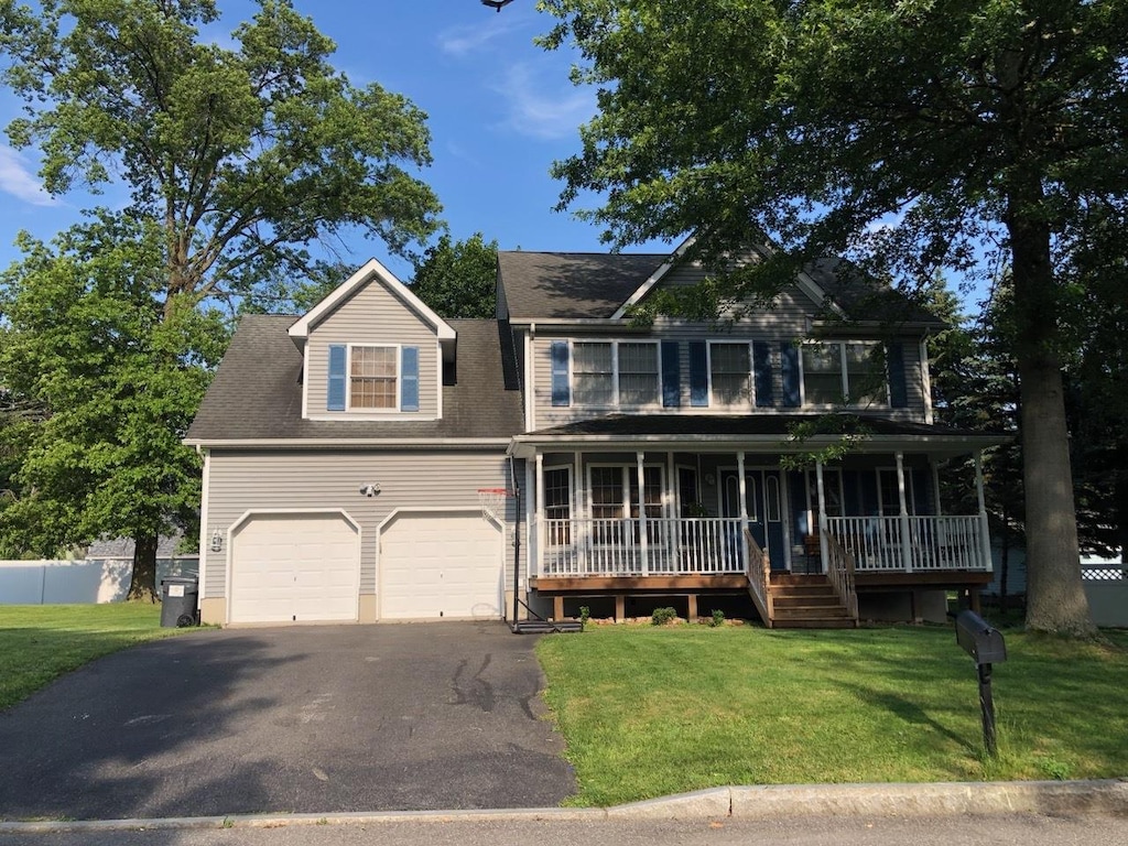 9 Utopian Pl, Walden, NY 12586 - view of front of home with covered porch, driveway, and a garage
