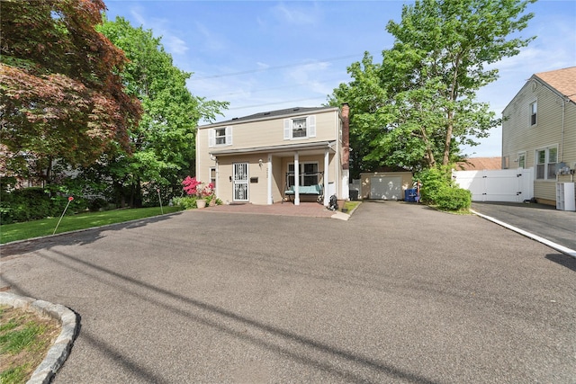 313 Concord Rd, Yonkers, NY 10710 - traditional-style house with a gate and covered porch
