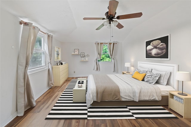 313 Concord Rd, Yonkers, NY 10710 - bedroom featuring multiple windows, wood finished floors, lofted ceiling, and ceiling fan