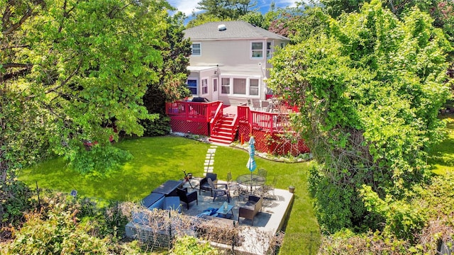 313 Concord Rd, Yonkers, NY 10710 - rear view of house with a wooden deck, a lawn, a patio, stairs, and an outdoor fire pit