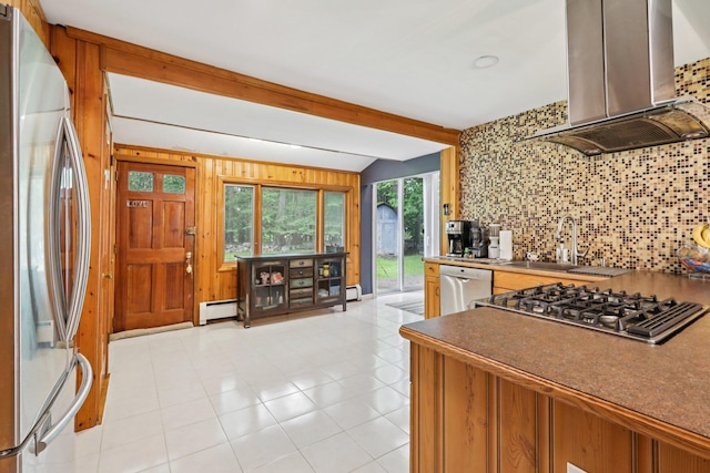 28 Nob Hill Rd, New City, NY 10956 - kitchen featuring appliances with stainless steel finishes, island exhaust hood, decorative backsplash, a baseboard radiator, and light tile patterned floors