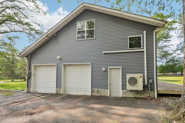 28 Nob Hill Rd, New City, NY 10956 - view of property exterior featuring an ac unit and a garage