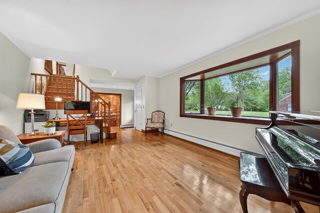 19 Ridgeview Ter, Goshen, NY 10924 - living room featuring stairs, crown molding, a baseboard heating unit, wood finished floors, and baseboard heating
