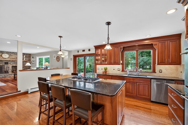 19 Ridgeview Ter, Goshen, NY 10924 - kitchen with appliances with stainless steel finishes, baseboard heating, healthy amount of natural light, a breakfast bar area, and recessed lighting