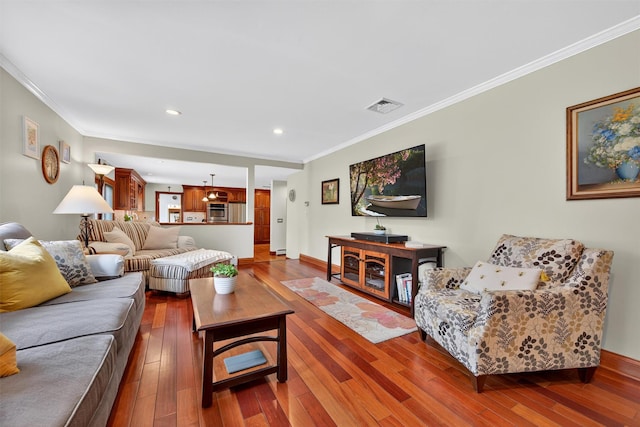 19 Ridgeview Ter, Goshen, NY 10924 - living area with wood-type flooring, crown molding, and recessed lighting