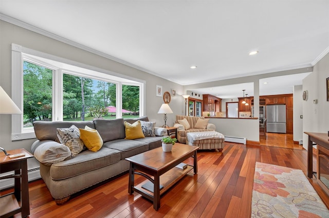 19 Ridgeview Ter, Goshen, NY 10924 - living area with baseboard heating, crown molding, hardwood / wood-style floors, and recessed lighting