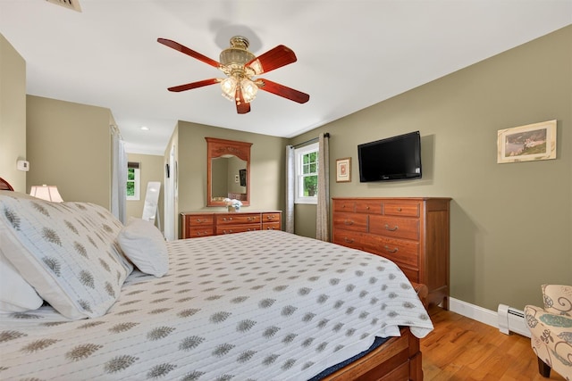 19 Ridgeview Ter, Goshen, NY 10924 - bedroom with light wood-style floors, ceiling fan, recessed lighting, and a baseboard radiator