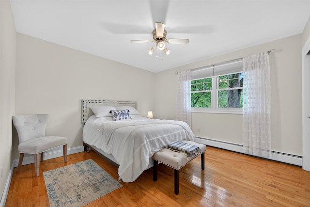 19 Ridgeview Ter, Goshen, NY 10924 - bedroom with baseboard heating, hardwood / wood-style flooring, and a ceiling fan