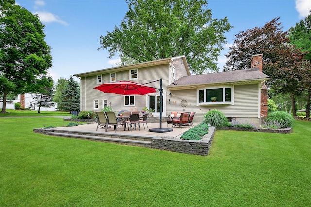 19 Ridgeview Ter, Goshen, NY 10924 - back of house with a chimney, a yard, and a patio area