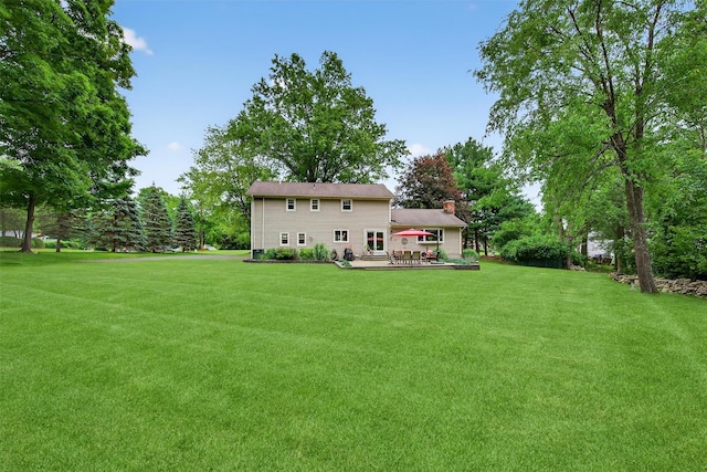 19 Ridgeview Ter, Goshen, NY 10924 - back of house featuring a yard, a chimney, and a deck