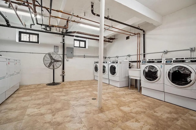 97-25 64th Ave Unit 5D, Rego Park, NY 11374 - shared laundry room featuring independent washer and dryer and electric panel