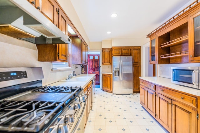 6419 Fitchett St, Rego Park, NY 11374 - kitchen featuring stainless steel appliances, under cabinet range hood, light countertops, recessed lighting, and glass insert cabinets