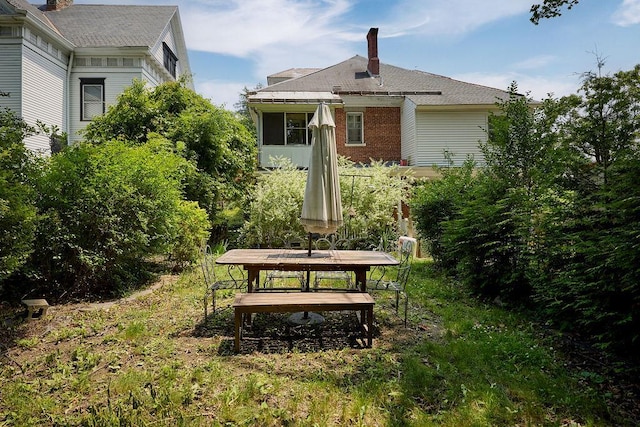 111 S Hamilton St, Poughkeepsie, NY 12601 - back of property featuring a chimney and outdoor dining space